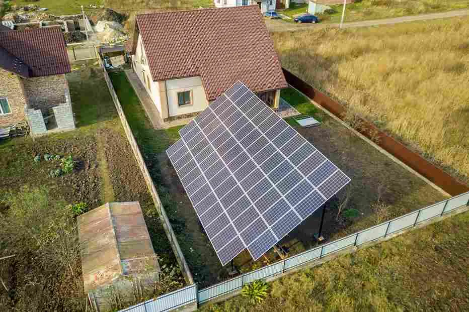 Rooftop solar panels on a family home illustrating Is 7 kW Enough to Run a House? for modern household appliances.