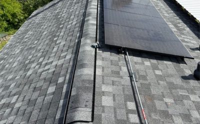 solar panels installed on newly replaced roof with modern roofing system