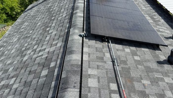 solar panels installed on newly replaced roof with modern roofing system